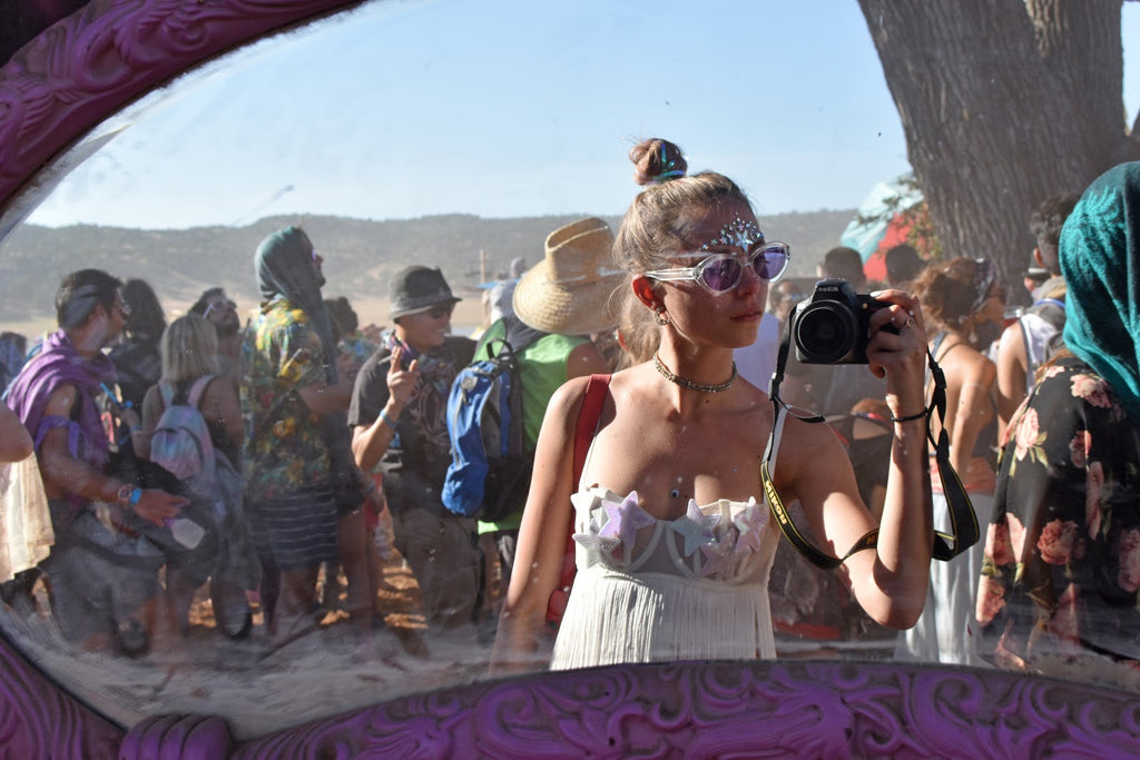 Girl Taking a Selfie at Lightning in a Bottle Music Festival