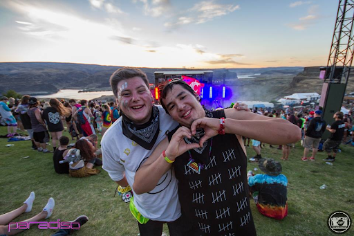 Ravers Throwing up a Heart Sign at Paradiso Festival