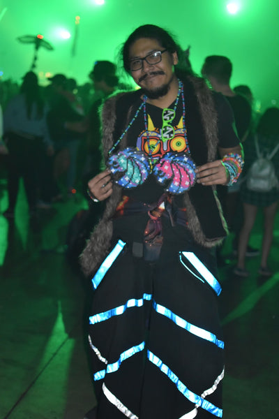 raver showing off his beaded necklaces