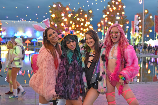 rave girls wearing matching fluffy jackets 