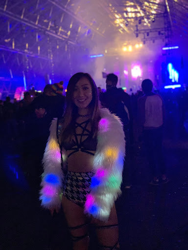 Girl wearing a light up fur jacket at Dreamstate USA 