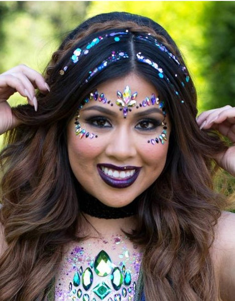 Raver Girl with Sparkly Glitter Strands in her hair and purple and green festival face gems