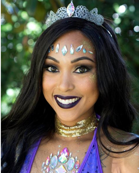 Raver Girls Wearing a Gold Choker Necklace, Purple Velvet Bodysuit, Festival Face Jewels and a Silver Crown