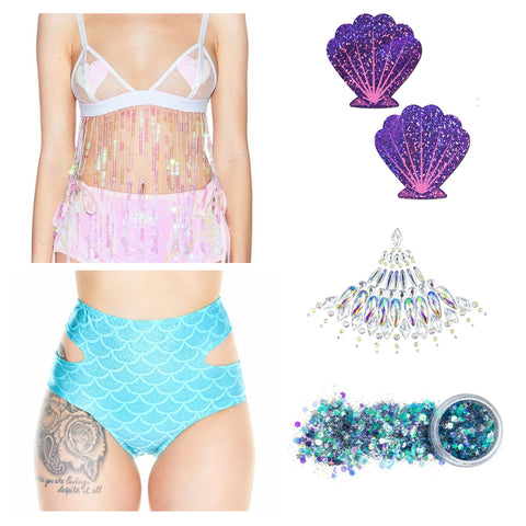 Plurmaid outfit with blue cutout mermaid high waisted shorts, purple and blue glitter, pink fringe halter top, festival jewels and purple seashell pasties