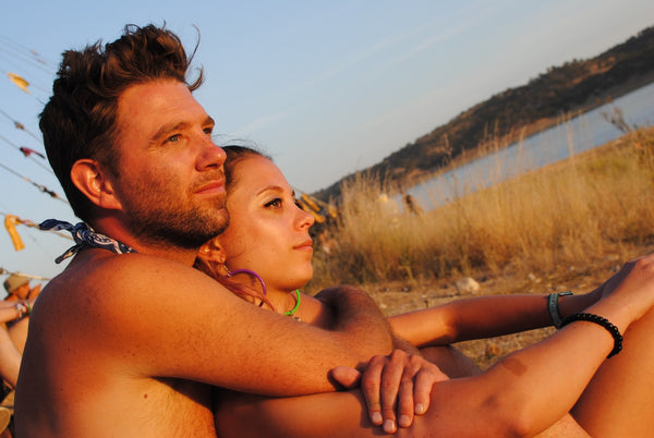 Couple watching the Sunset at Lightning in a Bottle Music Festival