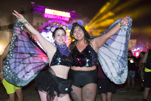 Girls wearing butterfly wings at nocturnal wonderland
