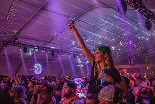 Raver girl holding budweiser tall can