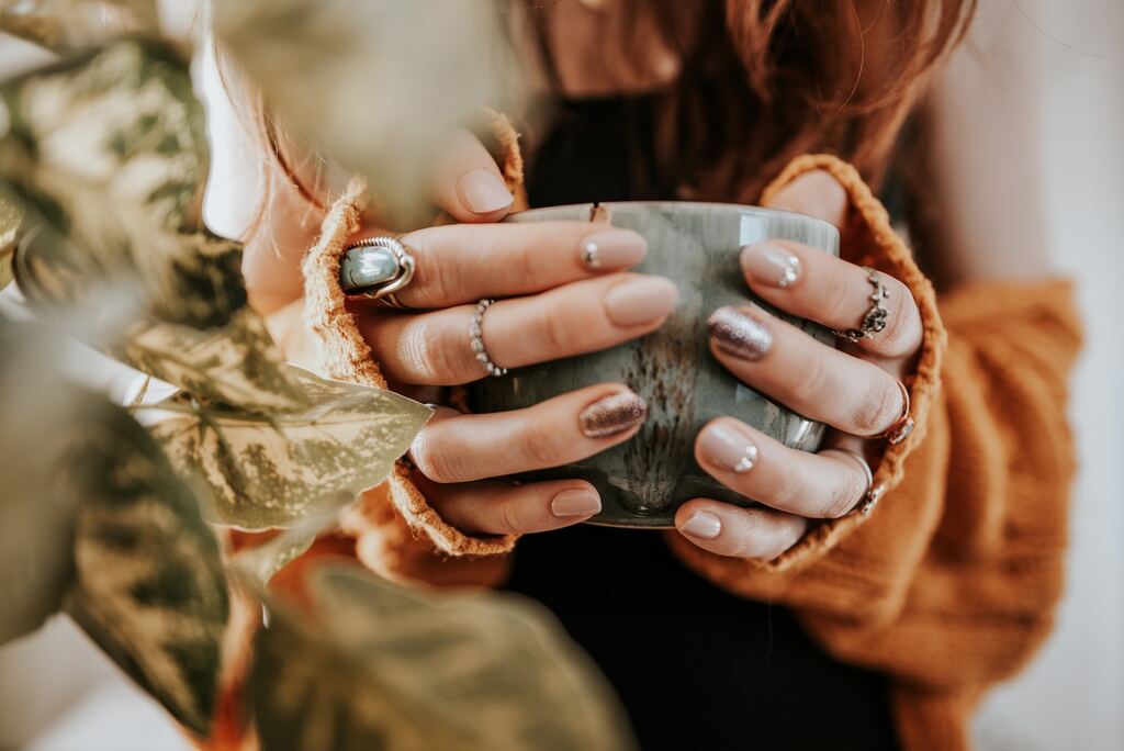 Person holding silver round coin