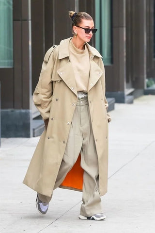 Gigi Hadid wearing a beige trench coat