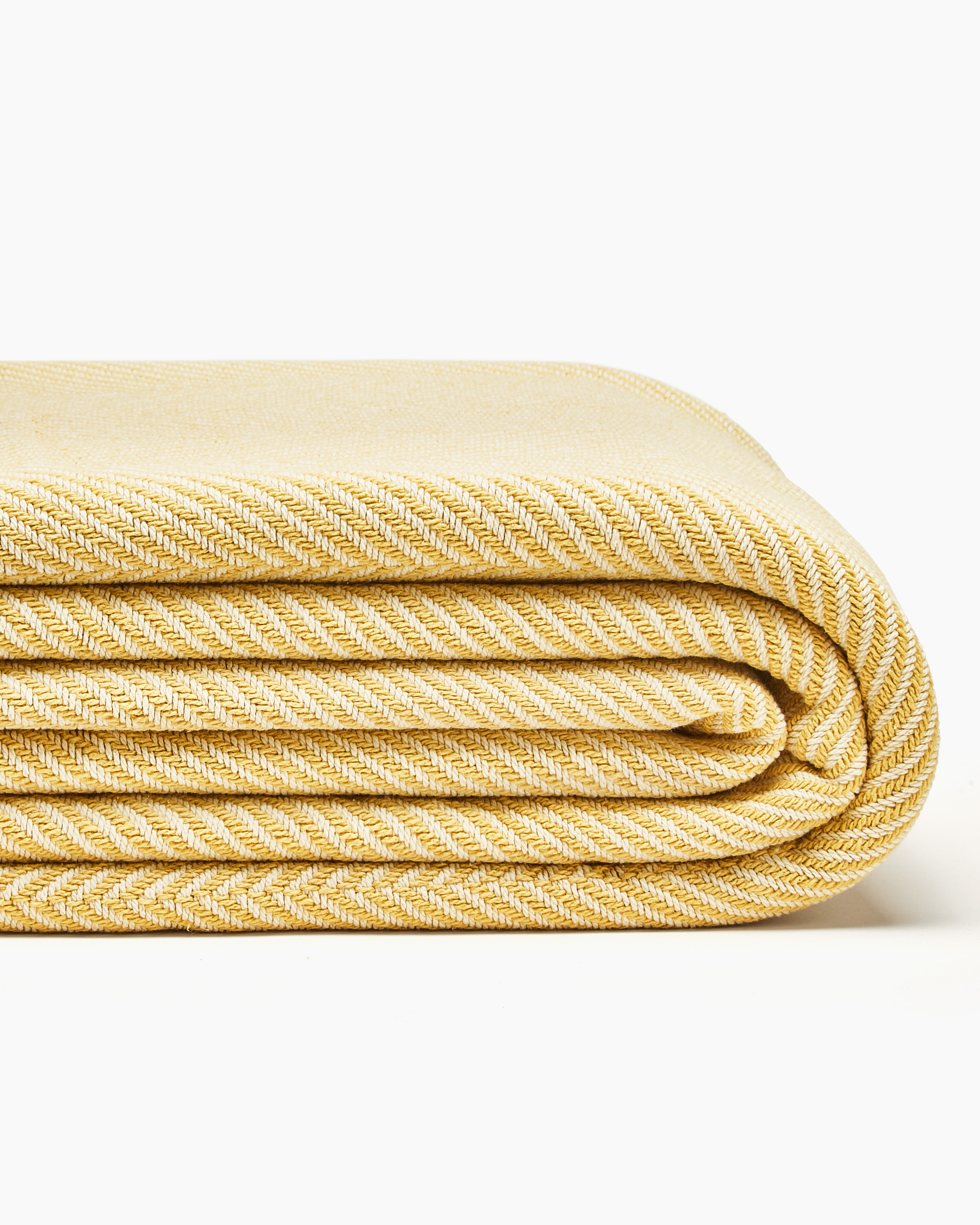 https://cdn.shopify.com/s/files/1/0984/2886/files/made-in-the-usa-cotton-herringbone-blanket-yellow-best-blanket-2023-award-winner.png?v=1683924497&width=2048