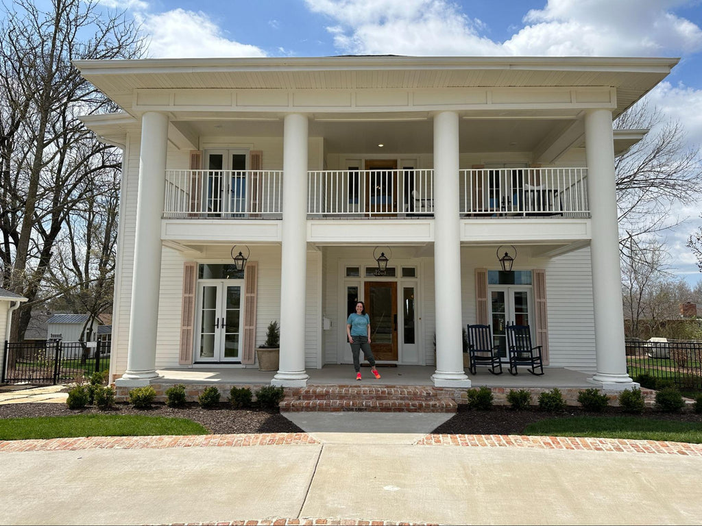 Co-founder Steph in front of Jenny & Dave Marrs' Welcome Inn: Rogers AirBNB in Rogers, Arkansas