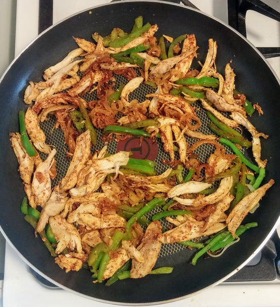 up close photo of seasoned chicken pizza toppings