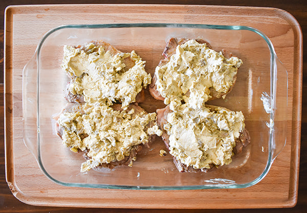 green chile cream cheese mixture added on top of pork chops before baking them 