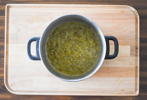 diced green chilies sauteed in butter in pot 