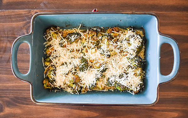 shredded parmesan cheese added to top of broccoli