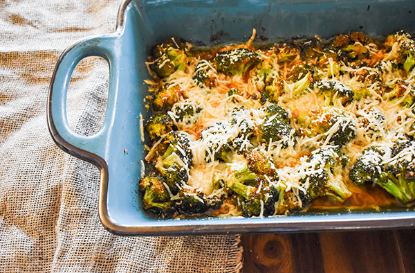 parmesan roasted broccoli in baking dish ready to eat