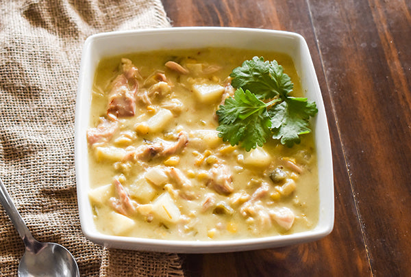 Green Chile Chicken and Corn Chowder in Bowl with cilantro garnish