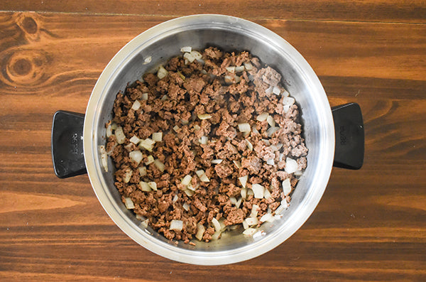 diced onions added with browned ground bison in pan