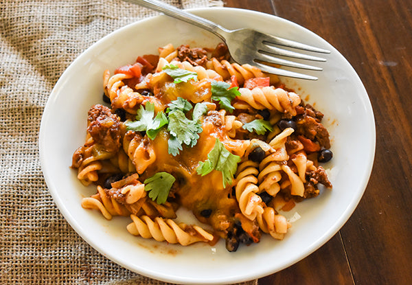 bison taco pasta bake on plate with fork