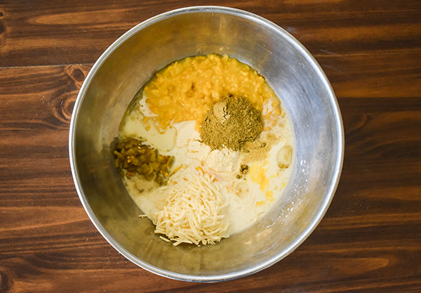 green chile cornbread ingredients in bowl ready to mix