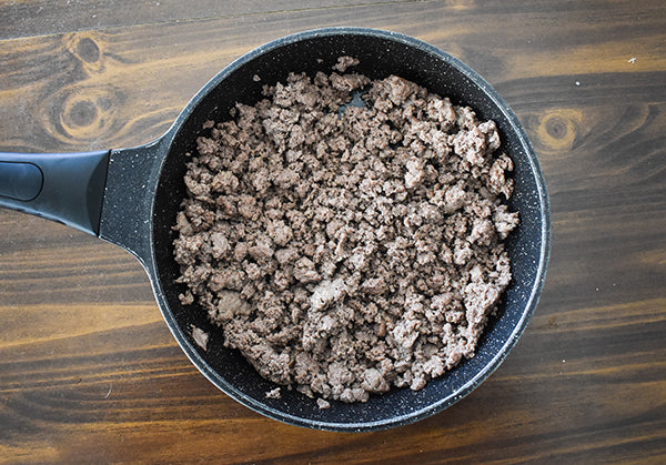 browned ground beef in skillet