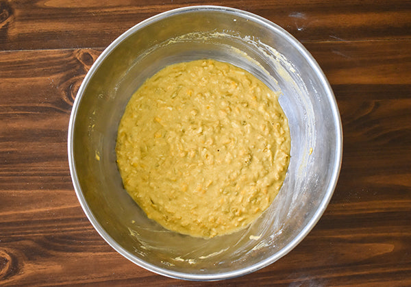 green chile cornbread batter in bowl