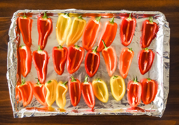 Mini peppers with seeds removed and cut in half 