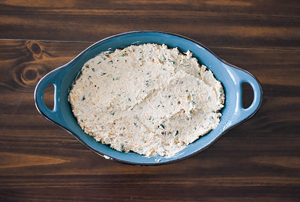 Bacon jalapeno popper dip in baking dish ready to be baked at 375 degrees for 40 minutes 