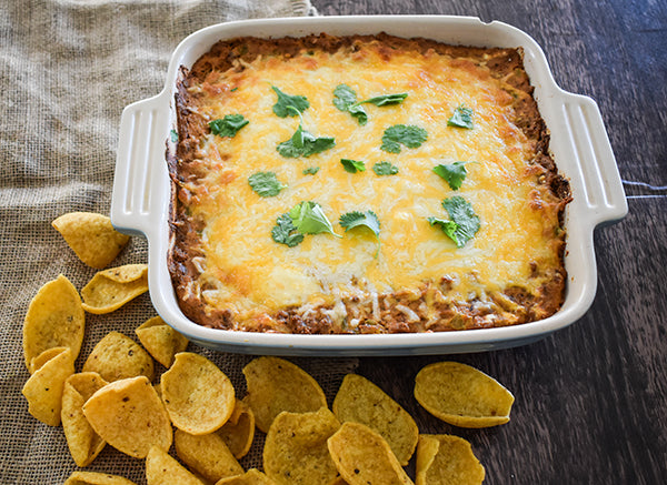 creamy fiesta bean dip served with corn chip scoops