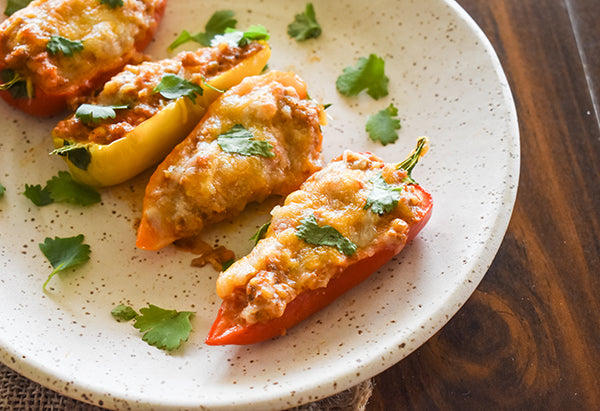 sausage and cream cheese stuffed peppers on plate 