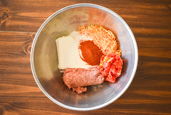Spicy cream cheese sausage ball ingredients in mixing bowl