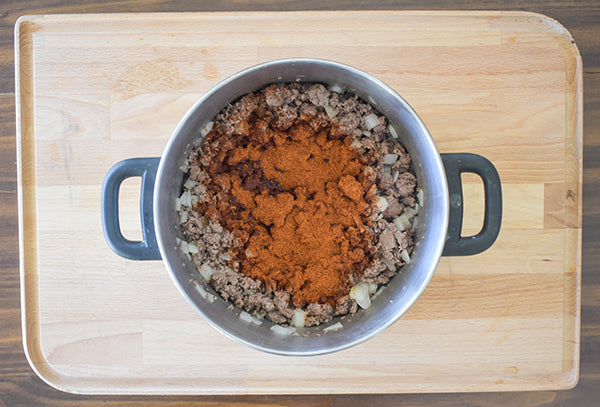 chugwater chili seasoning added to browned ground beef with diced onion