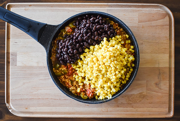 drained corn and rinsed and drained black beans added to skillet