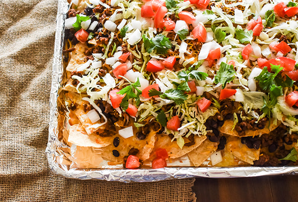 sheet pan beefy nachos on baking sheet ready to eat