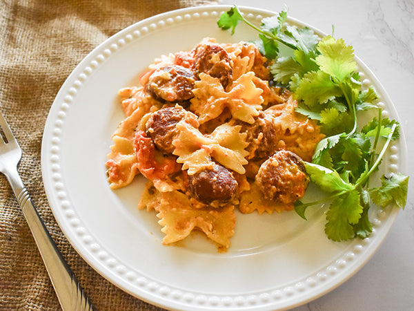 baked feta tomato pasta on plate ready to eat