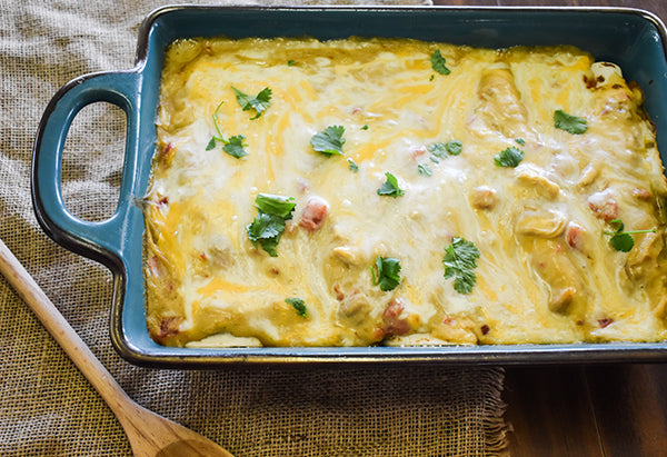 chicken enchiladas in pan ready to eat