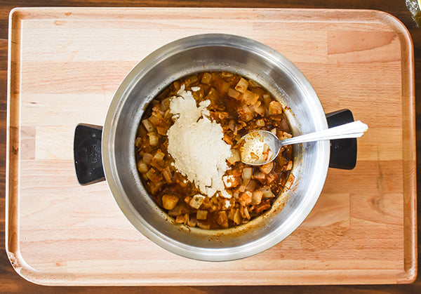 Flour added to seasoned sautéed onion to make a roux 