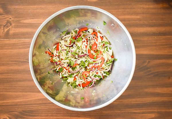 coleslaw vegetables mixed in bowl ready for dressing