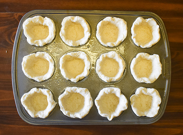biscuit dough cups in muffin tin
