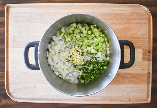 onion, jalapeno, garlic, and celery in medium pot with olive oil