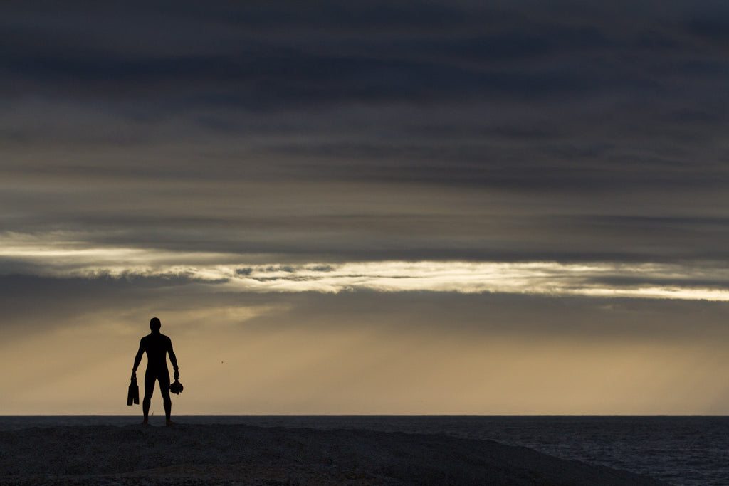 Silhouette of Sealand Gear ambassador Sacha Specker about to enter the water