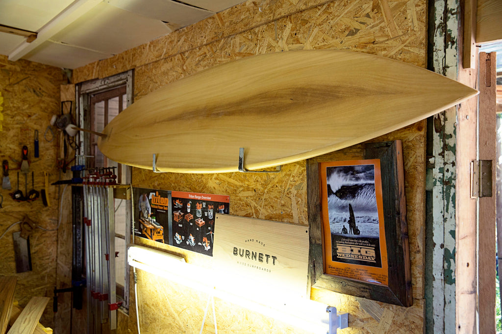Wooden Surfboard hanging on the wall