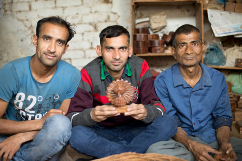 Quasim (far left), Sachin (middle), and Mukul (far right), have been wood carving artisans for over 10 years in North Central India