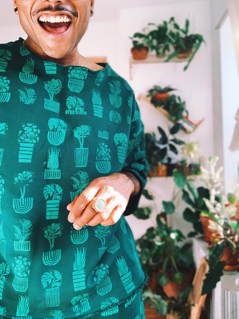 Hand-printed jade green sweatshirt with house-plant print 