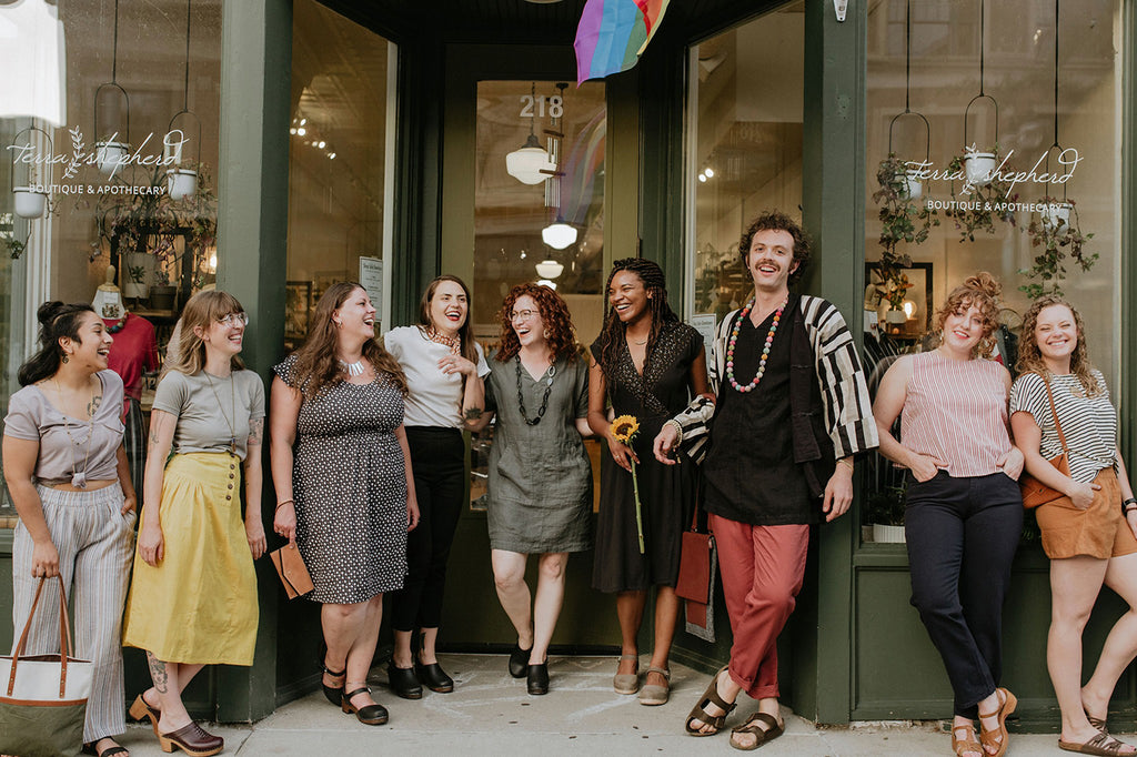 Members of the Terra Shepherd community in front of the shop. 