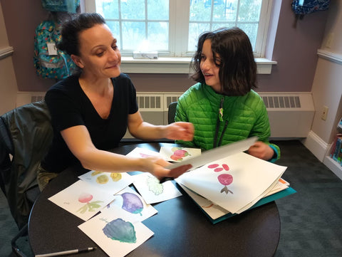 Gab working with zoe and mentoring her with her handmade greeting cards