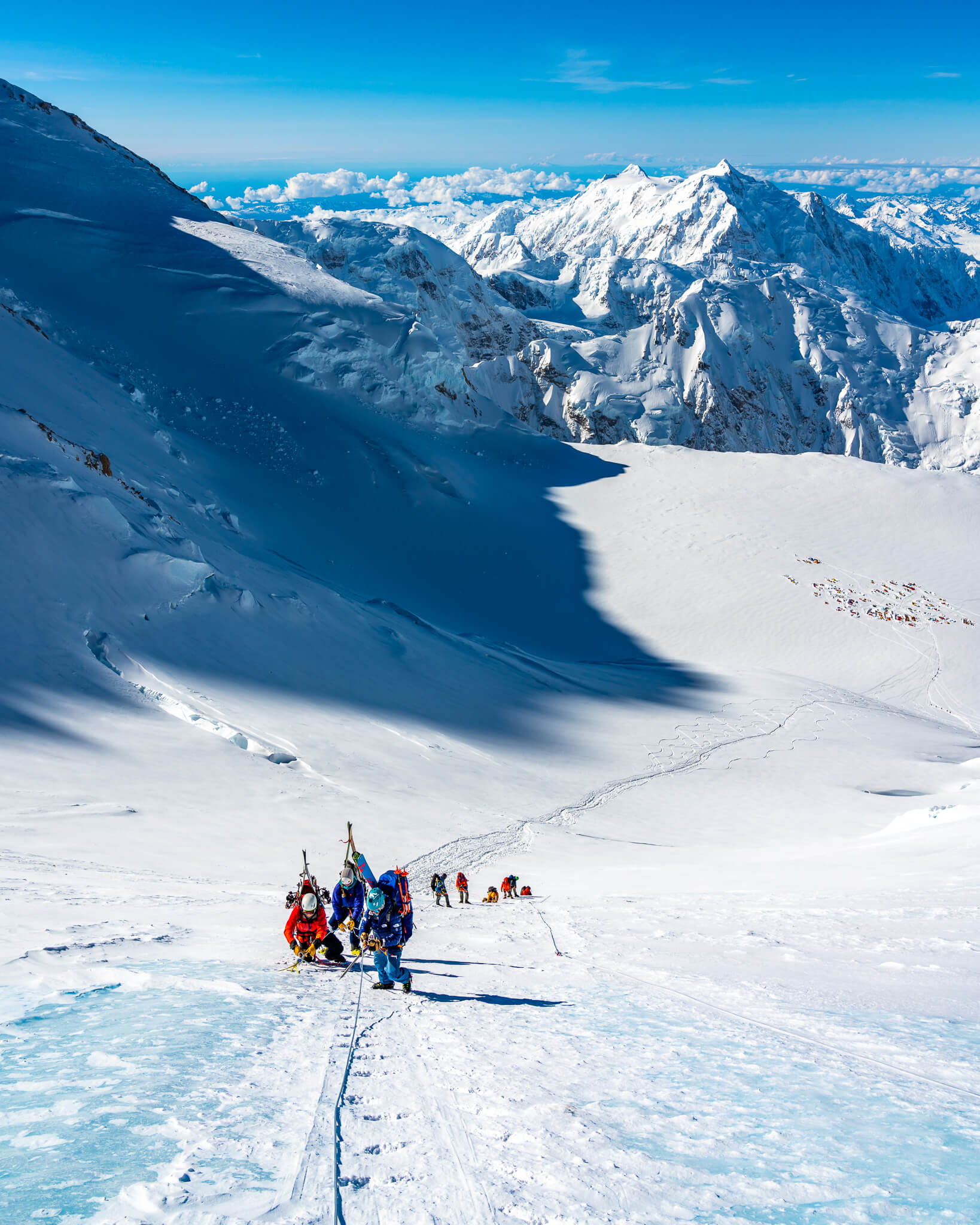 The team ascending fixed lines over blue ice, near 16,000 feet on Denali
