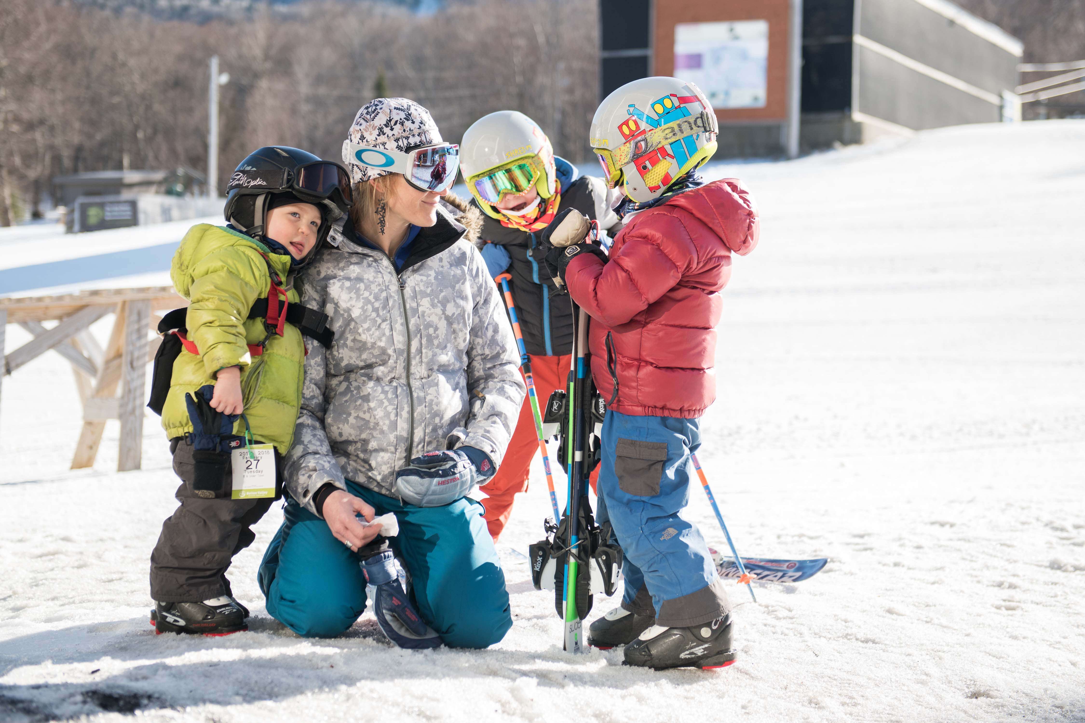Mother with kids in ski gear