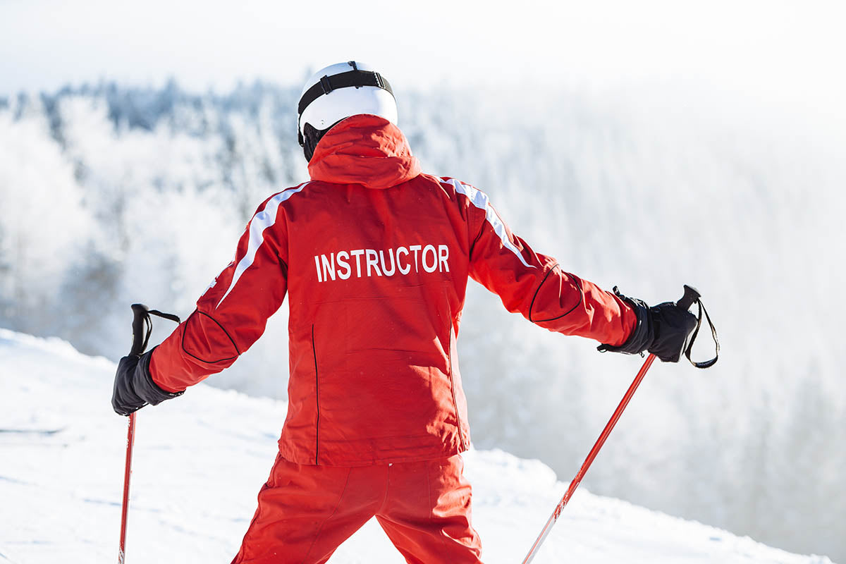 Ski instructor facing away from camera