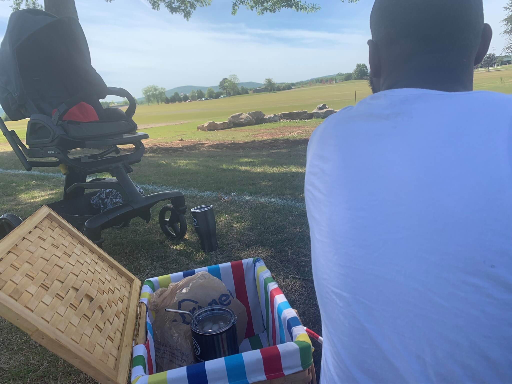 sitting in a park having a picnic